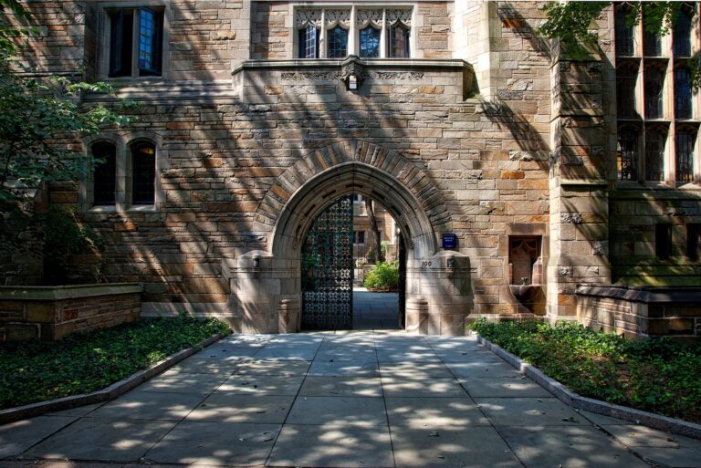 steel gate of brown brick building